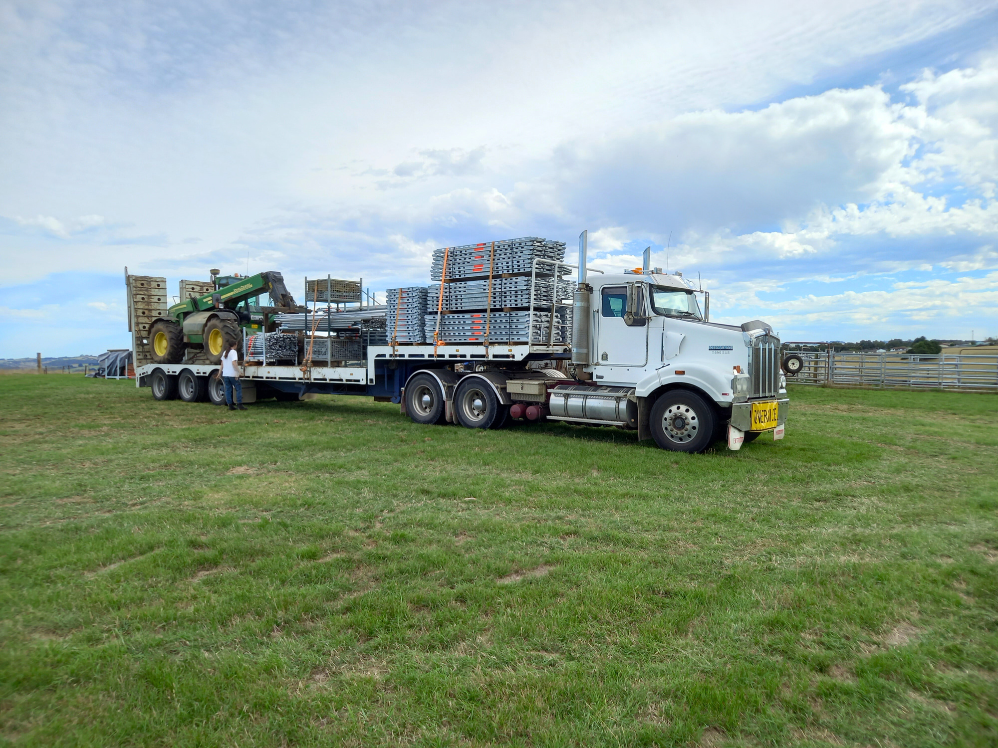 Leongatha based business Scaffdex loading a truck with scaffolding and telehandler ready to transport to jobsite.